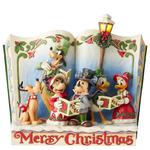 Rodzinne śpiewanie kolęd figurka w formie otwartej książki Merry Christmas (Christmas Carol Storybook) 6002840 Jim Shore figurka ozdoba świąteczna miki minnie donald gofu w sklepie internetowym MoodGood.pl